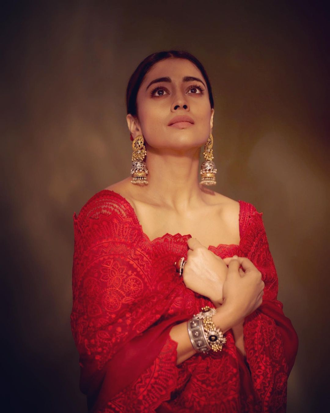 The Dishryam 2 actress Shriya Saran exudes elegance in a red saree