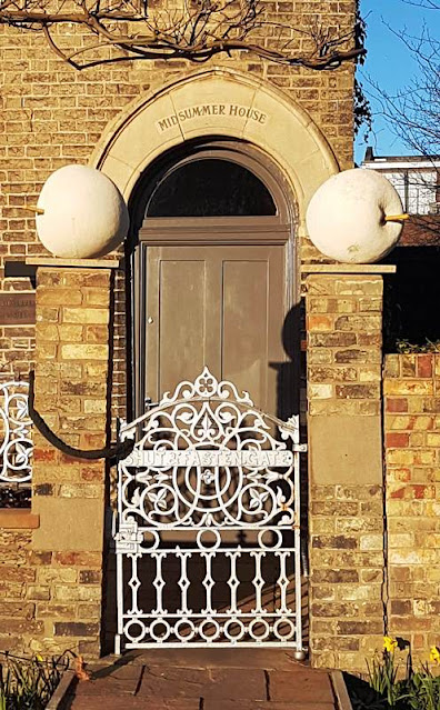 Gateway to Midsummer House with apple capital