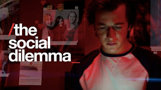 Image of a teenager looking at his screen with various view options available on his phone, the text shows the movie title "the social dilemma"