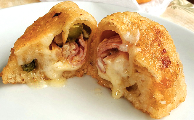 cut open hot fried cuban hot pocket