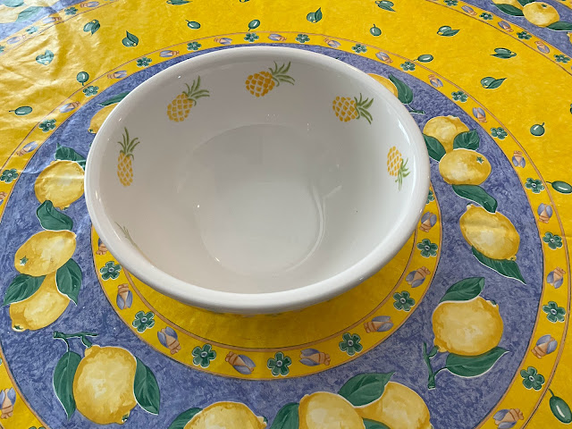 yellow bowl with drawings of pineapples inside