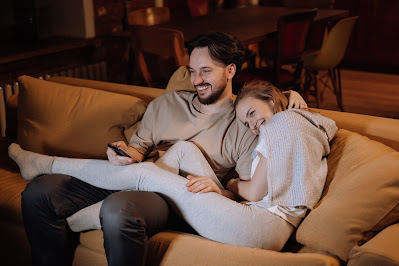 Couple watching movie on a couch