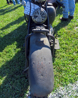Rusted fender of old motorcycle.