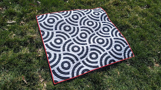 Raw edge applique circle themed quilt for pi day