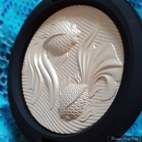 close look at textured highlighter with fish design embossing