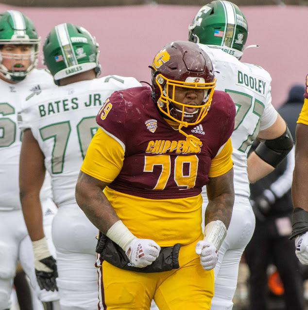 Central Michigan Chippewas player flexing in a NCAA college football game vs Eastern Michigan Eagles