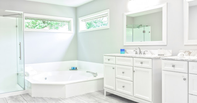 Large white bathroom with expansive whirlpool tub.