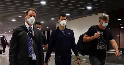 Djokovic (pictured with team at Melbourne Airport on Sunday night) organised to leave Australia within hours of losing his appeal