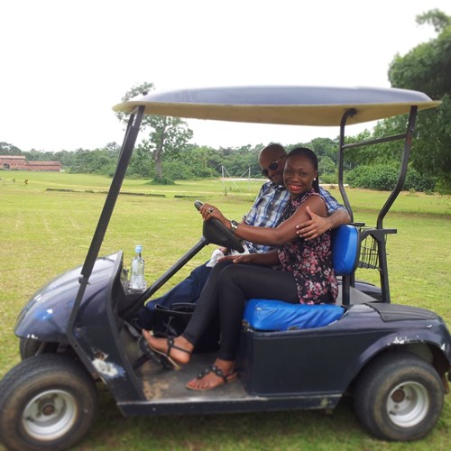 Ekemelu and Matse riding a golf cart