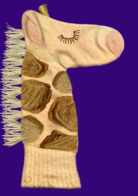 Giraffe hand puppet made by Necky Becky middle child of the Neckmann family of Giraffe World by Ingrid Sylvestre North East artist writer and entertainer Durham UK