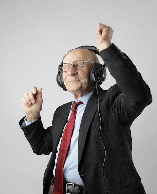 shows a senior citizen dancing by himself with headphones on.  Dancing like that releases endorphins.