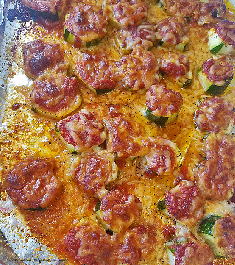 Sliced thick zucchini made into mini pizza with sauce and mozzarella on topped then baked