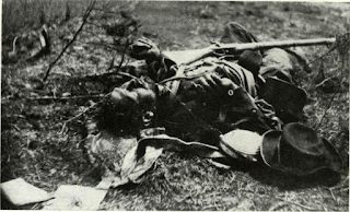 The sacred machine stopped. Ballistic shock, hemorrhage, brought life’s end to unknown Confederate soldier of Ewell’s Corps during attack of May 19, 1864. Bad luck, not bad armament, caused death, for his fine Enfield long rifle, good as the North’s best, lay near when Brady took this photo.