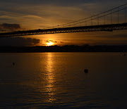 Tour Scotland Winter photograph of sunset behind the Forth Road Bridge over . (tour scotland winter photograph sunset forth bridge near edinburgh )