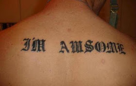 misspelled tattoo on the back: awsome