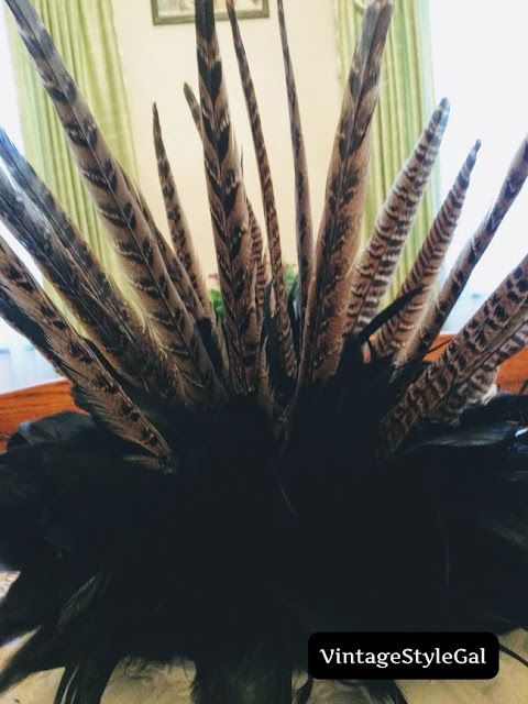 Close up pic of feathers coming out of urn