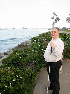 Marco smiling on the shoreline