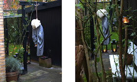 En hængt mand lavet af et skaft med ballon som hoved og arme af haveslange dingler som hængt mand i haven