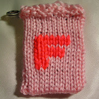 the letter F rendered in knitting