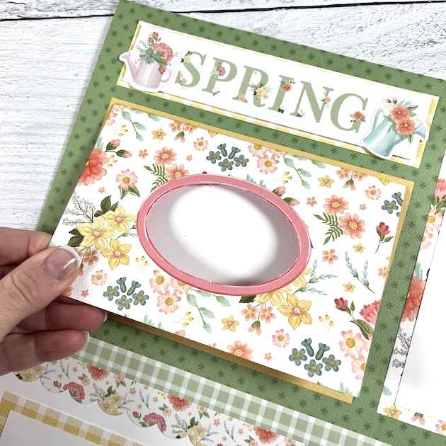 12x12 Spring scrapbook page layout with flowers, watering cans, and a folding card with a window