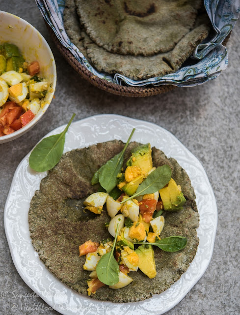 green (agasti leaves) kulcha bread and a wrap stuffed with egg avocado salad