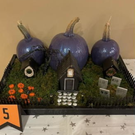 Photo of pumpkin decorated as a haunted house