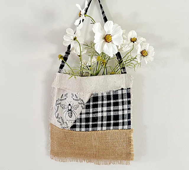 patchwork flower pocket on wall with flowers