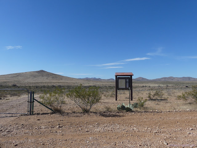 00: sign board with roof under a sunny sky