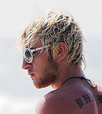 men surfer hairstyles image This guy looks cool with his tousled shag cut.