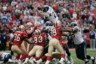 LT leaps high over the pile to score one of his 4 touchdowns.