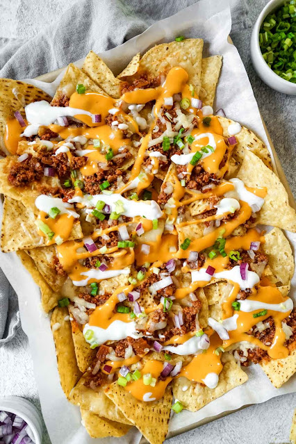 Chili Con Carne Nachos....a simple way to use up leftover chili - nachos baked on a big tray.