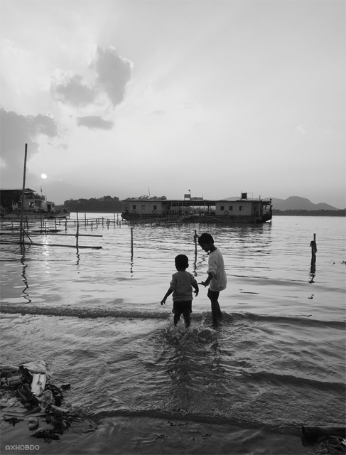 Kids playing near Brahmaputra Riverside during sunset