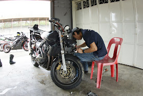 Edwin working hard at being a mechanic
