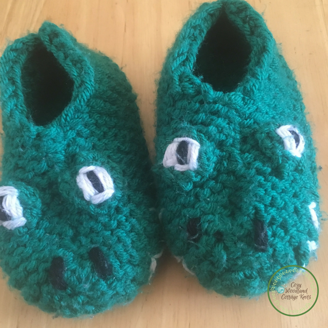 Child's knitted crocodile slippers