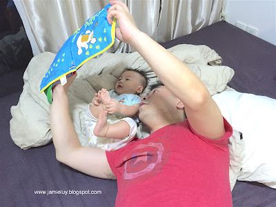 Baby reading a book