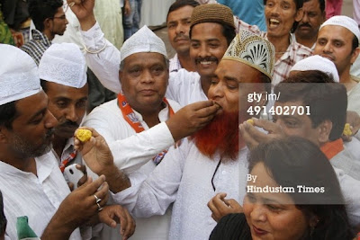 http://www.gettyimages.com/detail/news-photo/muslim-supporters-of-bjp-celebrate-partys-victory-by-news-photo/491402701