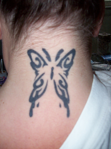 neck tattoos for girls. tattoo on neck for girls
