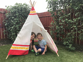 hape child teepee tent set up in the garden 