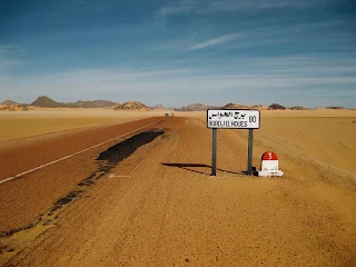the sign post telling 80 kilometres more to bordj el houes, southern allgeria