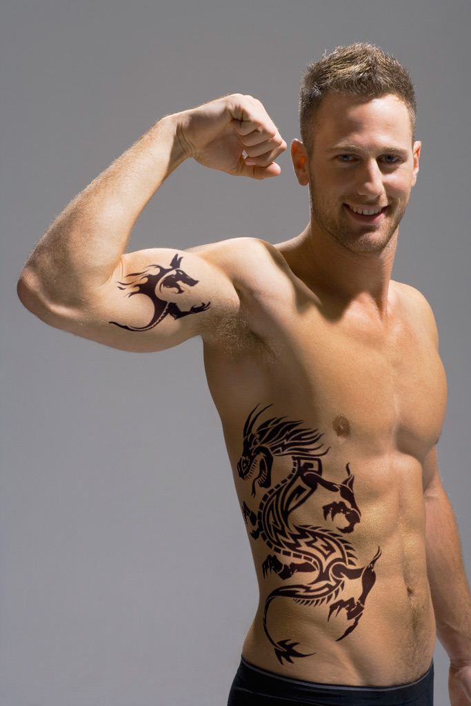 tribal tattoos for men on chest. inside arm tattoo. tribal