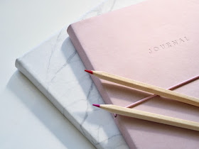 Pink journal and pencils