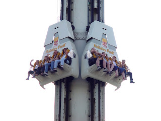 A theme park ride and the people aboard it is shown as a metaphor for the Record Den chain in 1997. No employees of the chain are visible in this photograph. We swear.