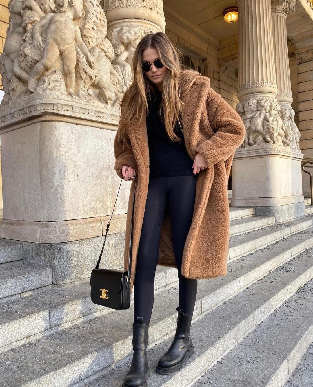 This Cozy Fall Outfit Is All I Want to Wear — @filippahagg in a camel teddy coat, black sweater, black leggings, and chunky lug-sole boots