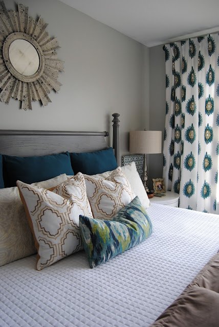 master bedroom, bedroom, bedding, how to make a bed, teal, teal bedding, white bedding, sunburst mirror, mirror over bed