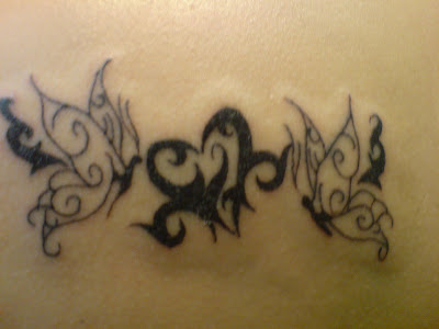 girly art tattoo upper back