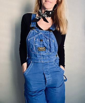 A pair of vintage DeeCee Overalls worn by a model