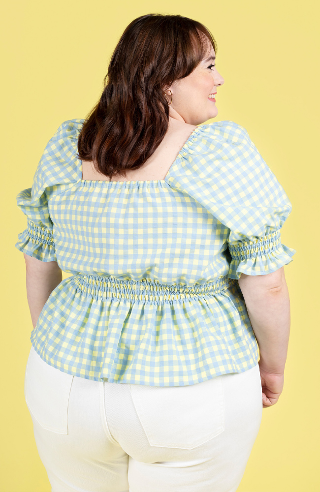 Plus size model wearing a shirred gingham blouse, made using Tilly and the Buttons Mabel sewing pattern