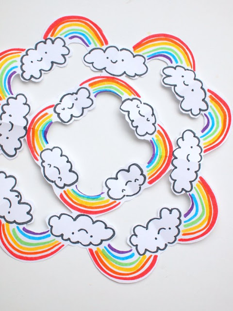 Cut rainbow snowflakes - A fun kirigami-esque craft that rainbow-loving kids are sure to enjoy