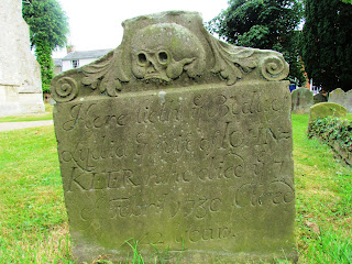 unusual gravestone, graveyard, Framlingham, churchyard, Christian, skull, creepy, old, weathered 