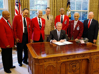 President George W. Bush is joined by members of the Tuskegee Airmen